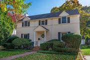 This beautiful 4 bedroom, 2.5 bath colonial was built in 1941. Upon entering you can immediately see that the home has been well cared for and retains much of its original charm including mahogany inlaid hardwood floors, 4.5 wide original window, floor, and door moldings, and a curved solid oak banister.  The foyer leads you to the formal living and dining rooms, both perfect for entertaining, and a hallway with a 1/2 bath that leads you to the eat-in kitchen. The first floor also includes a spacious sunroom, perfect for a den or playroom, with access to the backyard. There is also a large bedroom with an ensuite full bath that could be used as a first floor primary bedroom.  As you walk upstairs you are greeted with a charming reading nook, perfect for lounging in the sunlight from the bright window overlooking the front yard. The 2nd story also includes another large primary bedroom with double closets, two additional bedrooms, and a full bathroom.  The home features many updates including replaced roof, windows, boiler, an alarm system, and in-ground irrigation. The yard has mature plantings and is very private. A detached two car garage with ample storage sits at the back of the property. This home is nestled in a quiet, tree-lined neighborhood and is conveniently located only four blocks from the LIRR and a neighborhood entrance to the Wantagh Parkway. It is also only two blocks to the entrance to the Jones Beach bike/run path and Wantagh Park.