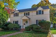 This beautiful 4 bedroom, 2.5 bath colonial was built in 1941. Upon entering you can immediately see that the home has been well cared for and retains much of its original charm including mahogany inlaid hardwood floors, 4.5 wide original window, floor, and door moldings, and a curved solid oak banister.  The foyer leads you to the formal living and dining rooms, both perfect for entertaining, and a hallway with a 1/2 bath that leads you to the eat-in kitchen. The first floor also includes a spacious sunroom, perfect for a den or playroom, with access to the backyard. There is also a large bedroom with an ensuite full bath that could be used as a first floor primary bedroom.  As you walk upstairs you are greeted with a charming reading nook, perfect for lounging in the sunlight from the bright window overlooking the front yard. The 2nd story also includes another large primary bedroom with double closets, two additional bedrooms, and a full bathroom.  The home features many updates including replaced roof, windows, boiler, an alarm system, and in-ground irrigation. The yard has mature plantings and is very private. A detached two car garage with ample storage sits at the back of the property. This home is nestled in a quiet, tree-lined neighborhood and is conveniently located only four blocks from the LIRR and a neighborhood entrance to the Wantagh Parkway. It is also only two blocks to the entrance to the Jones Beach bike/run path and Wantagh Park.