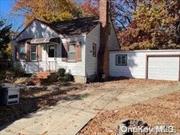 Investor special! Property being sold as-is. 4 Bed, 1 bath cape with Mid-block location and a HUGE yard. Living room with wood burning fireplace, large eat in kitchen and dining room. There is much potential for the next owner of this home!