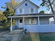 built in 1920 this colonial home along with a lovely porch is in need of a complete rehab. This colonial home sits on a huge property with a large 2 car garage which may have been a barn, back in the good old days. Currently the home has 2 bedrooms and 1 bath along with an eat in kitchen and good size living room and large unfinished basement . We have a set of plans to make this home a 4 bedroom 2 bath adding additional square feet to make this a total of 2200 square feet.. The plans are pending approval. sold as is. Or Sold renovated as a 4 bedroom family room 2 bath and partial finished basement with 2 car garage as per plans. CAN BE SOLD RENOVATED OR AS IS WHERE IS