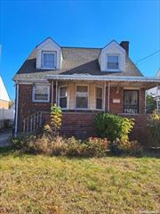 Own this nice and quiet home in the heart of Elmont. This blank canvas awaits your vision of the ideal home.  Exhale knowing that the Automatic Sprinkler system is keeping your grass green while you relax on your front spacious front porch. Sunlight pours into your bedroom through the perfectly situated skylight. Then enjoy your renovated basement in comfort outfitted with an egress window. Welcome home!