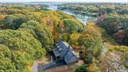 Discover the perfect blend of tranquility and adventure in this picturesque waterfront home located on the beautiful North Fork of Long Island. Enjoy water access to Peconic Bay, complete with deeded floating dock and mooring. This Custom Farmhouse style home features, an inviting living space with hardwood floors, Andersen windows, formal living room, eat in kitchen, family room with woodburning fireplace designed for comfort and relaxation. For your convenience, there is a first floor powder room and laundry room with pantry. Above you will find the primary bedroom with two walk in closets and ensuite bath. Two Additional bedrooms with ample closet space, an office nook, shared bath and a bonus space above the garage completes the second floor. The attached two car garage, full basement and attic, provide additional space for storage or expanded living space. Step outside and you will find your own slice of paradise from the full length mahogany deck overlooking Deep Creek. Whether you are fishing, kayaking, paddleboarding, or simply soaking in nature, this waterfront oasis, offers endless possibilities.  Need a boat too? This home may be sold with a 27&rsquo; Hunter Sail Boat, on the mooring and ready to sail. Enjoy the celebrated North Fork with it&rsquo;s beautiful landscape, vibrant farm-to-table cuisine, more than 60 vineyards, breweries, and craft distilleries, while being just moments away from shopping, Long Island Railroad, and Ferry access to New England. Don&rsquo;t miss your chance to own a slice of NOFO Waterfront Paradise!