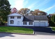 Move right in this Beautiful Center Hall Colonial with over 2300 Square feet of Living Space! 4 Bedrooms, 2.5 Bathrooms, Half Basement & 2 car oversized garage with room for 3 cars with Loft Area for storage. Large Eat-in-Kitchen, Formal Living Room, Formal Dining Room, and Large Family Room with Cathedral Ceiling. Ceramic Tiles and Recess lighting. All freshly painted - Brand new heating system - Mostly Anderson casement windows - Large Primary Bedroom with Brand new Bathroom. 3 more Bedrooms & a Main Bathroom with updates on the 2nd level. Brand new boiler - Central Air with 3 year coil - 2 cesspools in front yard - 6 Panel Doors, Fully fenced yard with Deck & more!