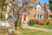 Welcome to this beautifully renovated 3-bedroom 3-bathroom center hall Cape located in the desirable Windsor Park neighborhood of Hartsdale. The home features an airy, open floor plan that is flooded by natural light. You will be welcomed into this lovely home by a welcoming foyer with custom built-ins which leads to a stunning living room with high ceilings, custom millwork and a cozy fireplace. A fabulous renovated kitchen awaits you with beautiful custom white cabinets, stone countertops, an oversized island, stainless steel appliances with French doors that open to the park-like backyard, and radiant heated floors! The main level also offers a large bedroom, beautiful full bathroom and home office. The second level features a spacious primary bedroom ensuite with a walk-in closet and a modern bathroom! This level offers another large bedroom and stunning renovated full bathroom as well as laundry. The home has been meticulously maintained and offers many updates/improvements including a new roof, new siding, a new deck and railings, new windows and doors on the lower and second level, luxurious renovated bathrooms, a new HVAC including 5 wall units, new forced air furnace, and a gas tankless hot water heater! Partially finished lower level offers additional living space and walks out to a custom stone patio. Step outside into your own private backyard oasis! Relax and take in the sights and sounds of tranquility from your huge deck overlooking the park-like property. Fabulous location near the Metro North train, public transportation, schools, parks, shops and delicious restaurants. Truly a must-see home!