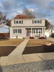 Lindenhurst 5 Bedroom Colonial with oversized property (59 x 172). Updated kitchen and bath. 4 Bedrooms upstairs with small room ready for second bathroom. Gas heat, gas water heater. Full basement. 1.5 detached garage. In ground sprinklers in backyard. New walkway, New patio. Great House!!!