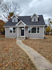 Sparkling totally renovated Diamond Cape on DOUBLE lot! Detached garage with fpl and separate electric! New windows, siding, roof. New laminate flooring throughout, Granite EIK with SS appliances, Island with extra storage, all bedrooms are spacious in size BUT the Master Suite has an open floor plan, is XL and giving off vibes for the GROWN & SEXY! lighted Big Walk in closet w custom cabinets and extra built ins, Open New Full bath with steam free LED mirror and granite vanity, truly an escape from everything! New 2 zone oil heat, New 150amp Service! The detached garage can be anything you desire! Has seperate electric, fpl, Big original windows, looks out to a double size lot on a little over. 50acre! Room for a backyard oasis!All advantages of the Village without Village Tax! Taxes w STAR approx $8, 600. FULL unfinished Basement w Bilco doors Verify all Info supplied Close to LIRR, Village and Major roadways.Seller kept some of the old world charm of yesterday, take note when looking! FLOOD insurance not needed!