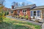 Welcome to 59 South Ohioville Road, a beautifully maintained brick home that blends charm with modern amenities, creating a perfect setting to unwind, entertain, and experience the best of the Hudson Valley. The custom-designed backyard steals the spotlight, featuring a heated saltwater pool with unilock pavers and hardscaping, a cozy fire pit area, and a full grilling area ideal for culinary enthusiasts. Host gatherings with ease in the expansive outdoor space, complete with a pool house offering shaded seating. For the farm-to-table enthusiast, vegetable gardens and a chicken coop allow you to enjoy fresh, homegrown ingredients in New Paltz. The light-filled main level welcomes you with a cheerful entry mudroom that leads into a fully remodeled kitchen, equipped with custom cabinets, granite countertops, a breakfast bar, and a coffee station. The living room showcases custom flooring and a wood-burning fireplace, opening up to a screened-in porch perfect for al fresco dining. This floor also includes three spacious bedrooms and a renovated full bathroom. The lower level is an entertainer&rsquo;s dream, with a secondary chef&rsquo;s kitchen featuring granite countertops, stainless steel appliances, and custom cabinetry ideal for seamless outdoor entertaining. This level also includes a second full bathroom with a Jacuzzi tub, a spacious living room, and a dining area, providing a versatile layout for gatherings. Additional conveniences include a two-car garage, 22KW Generac on demand whole house generator, and 500 gallon propane tank that is owned. Situated just minutes from the Hudson Valley Rail Trail, the heart of New Paltz, and with easy access to NYC, this home is perfectly positioned to enjoy the area&rsquo;s renowned adventures, dining, shopping, and all that New Paltz has to offer.