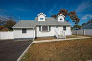 Newly renovated cape. Four bedrooms, two full bathrooms, updated kitchen with stainless steel appliances. Spacious living room with hardwood floors and access to adjacent family room, great space for entertaining. Full finished basement with outside entrance. Large yard, corner property with PVC fenced yard. Roof two years old, many new windows. Convenient location close to LIRR, LIE, Parkways, Schools, Shopping, Parks, etc.