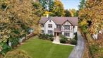 Step into the elegance of a bygone era at 15 Seymour Place in the historic Gedney Farms neighborhood of White Plains, NY. Built in 1924 by Robert Schwartz, founder of Paragon Oil, as his weekend retreat, this timeless Tudor-style residence tells a story of luxury and legacy. The second owners, the Mott family, purchased it in 1956, and today, it stands proudly maintained by only its third owners since 2004 a rare testament to its enduring appeal. Gedney Farms, once known as a luxury haven featuring the famed Gedney Farm Hotel and an exclusive golf club, has evolved into a sought-after residential enclave. It&rsquo;s a neighborhood where classic charm meets modern-day comfort, all just a short drive from downtown White Plains. This 6-bedroom, 3.5-bathroom home is the perfect blend of historic character and contemporary living. Inside, the grand living room with its original brick fireplace sets the stage for cozy evenings, while the formal dining room, adorned with a sparkling chandelier, awaits your next dinner party. The thoughtfully updated kitchen boasts high-end stainless-steel appliances, custom cabinetry, and granite countertops ideal for the modern chef. Upstairs, sun-filled bedrooms provide a serene retreat, each echoing the home&rsquo;s storied past. The lush, sprawling front lawn offers space for outdoor gatherings, and the mature landscaping enhances the property&rsquo;s timeless appeal. This is more than just a home; it&rsquo;s an opportunity to own a piece of White Plains&rsquo; history, nestled in the heart of one of its most cherished neighborhoods. Additional Information: Amenities:Storage, HeatingFuel:Oil Above Ground, ParkingFeatures:2 Car Detached, ConstructionDescription: Stucco,  InteriorFeatures: Bar,