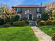 Nestled on a picturesque street in Pelham Manor, this stunning stone-and-brick front-hall colonial sits on a lush, half-acre of level, beautifully landscaped property. Dreaming of a pool? This expansive backyard, private and framed by greenery, is ready to bring your vision to life. The gorgeous slate patio, complete with a built-in outdoor kitchen, offers breathtaking views and an ideal space for entertaining. Inside, you&rsquo;ll be captivated by the grand 10-foot ceilings and an impressive entry foyer. Sunlight pours into the formal living room through cathedral windows, accentuating the warmth of the wood-burning fireplace. Adjacent, a beautiful stone sunroom/den serves as a perfect work-from-home space, game room, or cozy TV area. The spacious formal dining room and cheerful eat-in kitchen, adorned with stylish wallpaper, feature French doors that open onto the back patio. Upstairs, four bedrooms await, including a primary suite with a dual-sink bathroom, elegant built-ins, and radiant heated floors. Three additional bedrooms (one with its own sitting room) share a hall bath, completing the upper level. The finished lower level adds 836 sq ft of versatile space, perfect for a playroom, gym, or mudroom, with its own full bathroom and direct outdoor access.