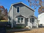 New Roof Siding and Windows, New Baths, Hardwood Floors, Basement, Rear Paver Patio.