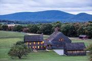 Set among the beautiful rolling hills on 203 acres is this private estate that takes you back in time. The farm was built in 2008 around a c.1754 Dutch barn that was dismantled from upstate NY and transformed into an incredible great room with 34&rsquo; soaring ceilings, a brick fireplace and two huge French doors to take in the view. Designed by Cynthia Filkoff with 6, 340 square feet, the main house offers five bedrooms and three and one half baths. The home feels centuries old, with the wide board floors and plaster walls throughout, while providing the modern conveniences, like the geothermal heating and cooling system and the automatic generator. Every room is a piece of art and history; comfortable, primitive and functional. Adding to the list of amenities is a two-car garage with loft; three bedroom caretaker&rsquo;s house; and equestrian facilities including a five stall barn, equipment barn, outdoor riding ring and six paddocks. The expansive property has trails throughout and was placed in the Dutchess Land Conservancy for love of the land. A once in a lifetime opportunity to purchase this private country estate. Just minutes to Pine Plains, and two hours to NYC.