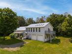 Property sits on both sides of the road and also fronts on Bell Hill Rd as well as County Rt 16 in Garrattsville which is a hamlet in Otsego County! Property consists of Black Walnut Trees, Apple trees and Rows of Sunflowers that creates a breathtaking views. Home is located just past the town of Oneonta and not too far from Cooperstown. Sky lights, radiant heat in Primary Bathroom & garage, wood stove. Huge Primary bedroom with balcony, office & primary bathroom. Kitchen has an island another area for cooking as well as a double oven, bar sink with on demand hot water. New Oil boiler, 3 year old computer controlled indoor wood boiler. Onan Diesel Generator. Multi Zone heating. Butternut Creek runs through this Stunning property & There is a 24x40 Barn.