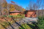 This unique, light-filled mid-century modern was built by renown local builder, Mickey Wangler, inspired by the simple clean designs of the Frank Lloyd Wright movement utilizing glass and wood to create a symbiotic presence with nature. This natural beauty home is located in a desirable 5-acre zoned neighborhood and boasts privacy and serenity with its convenient setting bordering on the Teatown Lake Reservation with over 850 acres of preserved open space and 14 miles of hiking trails. The house itself boasts a large passive solar sunroom with southern exposure, attaching a fabulous two-level dodecagon to another two-level modern structure. In addition to the large custom windows and sliding glass doors, wide plank pine floors and gorgeous brick fireplace with wood insert in the living room, the main house&rsquo;s unusual multi-angular interior is prominently displayed in the amazing ceiling design of the open space living areas. To enhance the feeling of living one with nature, the living and dining areas are surrounded with a large angular wrap-around deck which overlooks Bald Mountain. There is a beautifully-updated kitchen with custom cherry cabinetry, stainless steel appliances, granite countertops and a comfortable and environmentally sustainable cork floor, plus there are two bedrooms and a bath that complete this level. Following the same footprint below, there is a large comfortable family room where you can relax and also enjoy picturesque views of the surrounding woods, along with a bath, laundry and storage areas, and a sliding glass door that allows access fluidity to the sunroom and to the upper level deck. Most importantly to fit with today&rsquo;s modern living standards, there is a separate wing of the house with an oversized two-car garage with storage closets and, above that a desirable primary suite with a large bedroom and sitting room, both with oak floors, and plenty of closets. The manageable just-shy, two-acre property has many colorful trees and mature plantings, and a huge side yard with a shed. The land behind the house is preserved from development by the John Hand Westchester County Park. This southern Yorktown location falls within the sought-after Croton school district, and its convenient Teatown location is close to highways, and has a 10-minute drive to the Croton Harmon Metro North train station with a 46-minute express commute to Grand Central Station. Additional Information: Amenities:Storage, HeatingFuel:Oil Above Ground, ParkingFeatures:2 Car Attached, ConstructionDescription: Wood Siding,  InteriorFeatures: Built-in Features,