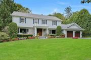 Classic and picturesque Center Hall Colonial situated on a stunning and serene half-acre in the Grange Estate area of Greenacres. Lush, sprawling lawns, mature trees, and evergreens offer a private and tranquil location. An ivy-covered stone wall at the front of the property adds to the charm. The thoughtful floor plan provides an effortless flow. The gracious entry hall is flanked by a spacious formal dining room and an expansive living room, transformed into a casual space ideal for entertaining. The updated and generously proportioned eat-in kitchen features radiant-heated floors, Rutt custom cabinetry, a Sub-Zero refrigerator, freezer/fridge drawers, wine fridge, a Thermador double wall oven, and a five-burner gas stovetop, perfect for the family chef. The breakfast area has sliding doors leading to a fabulous bluestone patio with a built-in Lazy Man BBQ (with direct gas line) and a large private yard, perfect for hosting get togethers and for play. Adjoining the kitchen is a spacious and bright family room with a wood-burning fireplace, built-in shelving and seating, a workspace, and breathtaking views of the property. The first level also includes a private guest/nanny suite with a recently renovated full bath, as well as a laundry room, mudroom with cubbies, and access to a two-car garage with ample cabinetry, a workbench, finished flooring, and enlarged garage doors suitable for an SUV. The second level offers four spacious bedrooms, one currently used as a home office, and a recently renovated hall bathroom with dual sinks and an oversized shower. The expansive primary bedroom includes a dressing room, walk-in closet, and private bath with a double-sink vanity, jacuzzi tub, and separate shower. The renovated lower level is perfect for kids and adults alike, with a large playroom (with yard access) and a versatile gym/media room with built-in surround sound. There is also a full bath and a kitchenette with a second dishwasher, second refrigerator, and sink. Additional interior and exterior renovations (2008-2022) include updated bathrooms, double Cat 5 wiring/Wi-Fi 6, remote app controls for Nest heating/AC, garage access, security system, an 8-zone built-in Sonos system across three levels plus the outdoor patio and select lighting. The home features HardiPlank Siding (never needs painting) and a new hot water heater installed in 2024. A multi-zone lawn sprinkler system keeps the beautiful grounds in pristine condition throughout the season. This welcoming residence, with its breathtaking curb appeal, is a wonderful place to call home. Close to all! Additional Information: Amenities:Dressing Area, Marble Bath, Storage, ParkingFeatures:2 Car Attached, Appliances: Wine Refrigerator,  ConstructionDescription: HardiPlank Type,  ExteriorFeatures: Gas Grill,  InteriorFeatures: Built-in Features,