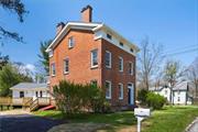 Discover an exceptional fusion of history and modern luxury as the new owner of the Seneca Howland House. Located in scenic Pleasant Valley, this unique 3, 596 sq. ft. brick and frame home beautifully intertwines its 19th-century charm with the sophistication of a 2024 renovation. Offering 4 spacious bedrooms and 3 bathrooms, this home is designed to impress. The main floor with two entrances, features a large, light-filled eat-in kitchen. Here, modern quartz countertops are complemented by an original exposed brick wall, preserving the home&rsquo;s authentic character. The kitchen flows effortlessly to a new wraparound deck, perfect for entertaining, while French doors lead to a den or library a cozy retreat for reading or working from home. The expansive living room opens to a formal dining area, where historic architectural elements blend with modern lighting and elegant chandeliers, adding a contemporary twist to its classic appeal. Ascend the antique staircase to find two potential primary bedrooms one with skylights for abundant natural light and custom built-ins. Two additional bedrooms and a fully renovated bathroom complete the second floor. The third floor boasts a spacious, unfinished attic with five framed-out rooms, wired with electricity and awaiting your personal touch. Recent renovations include: foam insulation in attic and in basement -NEW recessed lighting -NEW oversized Anderson windows on many select windows -NEW Soffits -NEW gutters -NEW siding -NEW sliding glass door -NEW roof -NEW light fixtures -NEW ceiling fans -NEW renovated bathrooms -NEW kitchen flooring -NEW refinished wide plank oak hardwood flooring -NEW refinished pine pegged hardwood flooring -NEW lighting fixtures -NEW Blacktop driveway. The home is walking distance to the quaint town of Pleasant Valley with its local shopping and restaurants plus a short easy commute to the Taconic State Parkway, Metro North Trains, Eastdale Village Town Square with its trendy boutiques and fabulous dining. Don&rsquo;t miss this opportunity to own a unique piece of Dutchess Counties history while embracing today&rsquo;s lifestyle. Additional Information: Amenities:Storage, HeatingFuel:Oil Above Ground, Appliances: Electric Water Heater