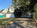 Large and spectacular 2-Family home situated at the rear of a 40x100 parcel, comes with additional 60x60 lot on Baywater Blvd, having spacious rooms, great layout, and excellent potential.
