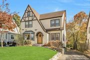 Discover timeless charm in this Storybook Tudor, featuring 4 bedrooms and 2 bathrooms, offering both comfort and character. Step into the inviting living room, complete with a wood-burning fireplace and a wall of built-in bookcases perfect for book lovers. A bright and versatile sunroom doubles as an ideal home office, while French doors open into a dining room filled with natural light. The cheerful kitchen leads to a spacious deck and steps down to a private patio with a relaxing hot tub. Upstairs, find three generously sized bedrooms and a full bath, while the third floor offers a bedroom, full bath, and ample storage. The finished basement includes a soundproof room, ideal for the family musician, and a Sonos sound system for an immersive audio experience. This home blends classic style with modern conveniences, perfect for comfortable living and entertaining. Come make this dream storybook tutor your new home! Additional Information: ParkingFeatures:1 Car Attached, ConstructionDescription: Stucco, Wood Siding,