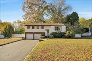 Welcome to 18 Greg Lane in East Northport! This spacious 4-bedroom hi-ranch offers versatility and comfort in a prime location within the highly desired Commack School District. The upper level features hardwood oak floors beneath the carpeting and an extended eat-in kitchen with wood cabinetry, white appliances, and a cozy sitting area at the back-perfect for gatherings. A sliding door from the kitchen opens to a deck with stairs leading to the expansive backyard, ideal for outdoor enjoyment. The primary bedroom includes a convenient half bath. Additional highlights include central air conditioning, forced hot air heating, and natural gas fuel. The roof is only 10 years old, and the central AC system was updated just 8 years ago. The lower level boasts a generously sized family room with carpeting and a dedicated laundry room. Completing this home is an oversized driveway and a 2-car attached garage, providing plenty of parking and storage space. Situated near Burr Intermediate and Commack High School, with easy access to shopping and amenities, this home is a fantastic opportunity in one of East Northport&rsquo;s most sought-after neighborhoods.