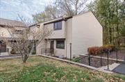 Welcome to this beautiful, two bedroom, end-unit townhome at The Commons at Cedar; a lovely community tucked away on the highly desirable southside of Poughkeepsie. The walkway to this home, framed by stone walls and manicured landscaping, leads to an appealing bluestone entry. Inside, you are greeted by gleaming wood floors and an open concept layout. The dining room, flooded with natural light from the expansive window is wide open to the kitchen which flows nicely into the spacious living room.  The kitchen has been updated with shaker cabinetry, soft-close drawers, a double sink and stainless steel appliances. The living room, large enough to accommodate an additional dining area, is illuminated by sunlight streaming in through the sliding glass door.  The patio backs up to woods creating a sense of calm and privacy. An elegant powder room adorned with tasteful wallpaper and quality fixtures completes the main floor. As you ascend the stairs to the second level, you are received by a generous landing area offering entry to both bedrooms and the main bath. The primary bedroom is extremely spacious and includes a walk-in closet as well as a second, oversized closet. The full ensuite bath will wow you. Enjoy a tiled shower, a gorgeous vanity and pleasing finishings. The second bedroom is generously sized and also includes a walk-in closet. The main bathroom was recently refreshed. You will love this community. Enjoy a brand new inground pool, a fully renovated clubhouse, tennis courts and the convenience of 2 assigned parking spaces. Close to shopping, restaurants, the Poughkeepsie train station, the waterfront, medical facilities, public transportation, Vassar College, major highways and all that the fabulous Hudson Valley has to offer.