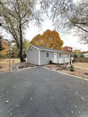 Welcome to this beautifully renovated 3-bedroom, 1-bath ranch located on a large 16, 117 sq ft lot in Bay Shore, NY. This charming home offers a brand-new exterior with updated siding and windows, giving it great curb appeal. Inside, you&rsquo;ll find a spacious, open living area with fresh, modern finishes and wood accent walls, creating a cozy and inviting space. The fully updated kitchen boasts sleek white cabinets, stylish backsplash, and new stainless-steel appliances, perfect for both cooking and entertaining. The property has an impressive, private backyard, ideal for outdoor gatherings, with a small deck for seating. The long driveway easily accommodates 4+ cars, providing plenty of off-street parking. Enjoy the peaceful setting while being conveniently located near shops, dining, and is conveniently located just under 10 minutes away from Tanger Outlets in Deer Park.