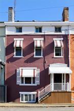 Introducing the Clarice Market Townhouse. Built in 1863, the four level home sits directly across from the bustling Hudson Farmer&rsquo;s Market and all downtown Hudson amenities. Spacious and bright, with elegant original details and functional updates, the townhome is a perfect single family residence or as an investment opportunity in its current configuration: Three separate living units with kitchens and private entrances.The recently redone exterior is bright and welcoming with new paint, windows, and doors. Upon arrival, a grand center hall opens up to a winding staircase, the first floor one bedroom apartment, and access to the one bedroom basement apartment. The main living area consists of a fully updated kitchen, sitting room, den, bathroom, storage, and three bedrooms on the upper level. All levels of home lead out to multiple decks and a full staircase to the courtyard perfect for gardening and dining leading to a traditional Hudson carriage house ready for use. Additional Information: ParkingFeatures:1 Car Detached,