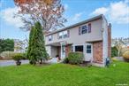 This Wonderful 4 Bedroom, 2.5 Bath Colonial, with Welcoming Entryway, Sits on shy a Quarter acre Lot in the Neighborhood of Manor Park, Eastport South Manor School District. Inside, an Updated Kitchen Boasts Modern White Shaker Cabinets with Elegant Granite Countertops and Tiled Backsplash. The Living Room and Dining Room Features Ample Natural Lighting with the Living Room Flowing Seamlessly into a Formal Dining Room Perfect for Gatherings and Dinner. A Cozy Den with Wood Burning Stove, Offers Additional Living Space for Comfort & Relaxation. Updated 1.5 Bathrooms are designed with Contemporary Finishes Ensuring Comfort & Style. Upstairs Features Four Spacious Bedrooms Which Include a Huge Primary Bedroom with 2 Closets, One of Which Has Plumbing in the Wall For a Future Ensuite.  3/4 Partial Basement and One Car Garage offers Plenty of Room for Storage. The Backyard is a Nice Size With Room For Outdoor Activities. Make This Home Yours!!