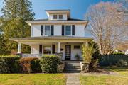 Tucked behind a hedgerow on a generous corner lot in the Village of Rhinebeck, find this beautifully maintained c1916 Craftsman home. Up bluestone steps flanked by stone base and wood post pillars, there is a generous front porch which spans the length of the house. Step inside to see a classic craftsman staircase, a generous foyer and gleaming wood floors and stained glass details. A classic four square design includes the foyer, sitting room, dining room and kitchen on the main floor and 3 bedrooms and a large bathroom on the second floor. The main floor also has an addition in the back with a den, 1/2 bath and laundry. The kitchen is updated featuring a Liebherr fridge and Bosch appliances, a large island and plenty of storage. Exposed beams, paneled walls and wood floors throughout. The basement has high ceilings and plenty of space for a workshop or home gym. The side yard features a private fully fenced patio area with an in-ground salt water, heated pool, beautiful hardscaping, including a sitting garden tucked behind the one car garage.