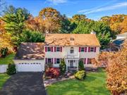 Welcome to this beautiful 4-bedroom, 2.5-bath Colonial home, situated on over 1/3 acre of landscaped property. The home has been thoughtfully updated and is move-in ready, featuring a freshly refinished hardwood floor on the main level and 11 brand-new windows that fill the space with natural light. The spacious eat-in kitchen is a true highlight, offering sleek granite countertops, stainless steel appliances, and updated cabinets with convenient pull-out shelves for easy access and organization. The primary bedroom is a true retreat, complete with a large walk-in closet and a private, 4-piece en suite bath, offering a serene space for relaxation. Each of the additional three bedrooms is generously sized and features closet organizers to maximize storage. The home also boasts two skylights that bring in additional sunlight, making every room feel bright and airy. The finished basement is equipped with a French drain, providing extra peace of mind by ensuring the space stays dry year-round. Outside, the property features a large deck perfect for outdoor entertaining, surrounded by mature trees and lush landscaping. The home is also equipped with a 7-zone in-ground sprinkler system and PVC fencing on three sides, offering both privacy and curb appeal. Additional features include a 2-year-old stove and washing machine, a central vacuum system, and more.