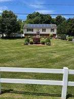 Beautiful raised-ranch; move-in ready. Minutes to Taconic Pkwy., I-84 and Hudson Line stations. Extras: hardwood floors, silestone tops, breakfast bar, coffered living room ceiling, guest bedroom with Murphy bed, hallway pantry, crown-molding, stainless steel appliances; built-in wet-bar with custom-made shelves/lighting, pool room; double-filtered water softener; 1000 gal water tank; double-tiered deck/above-ground 18 x 36 pool; heated garage; solar panels (no contract); full attic for storage w/ auto fan; back-up generator; shed and enclosed garden with chain-link fence. Driveway is double-wide plus.