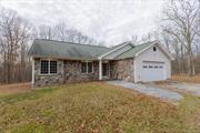 Welcome to your home in the country! Move right in to this charming 3 bed, 2 bath ranch. Features include wood burning stove, gorgeous hardwood floors, large deck accessed via 2 rooms by 2 sets of sliders Gorgeous custom Birch kitchen, including pot filler and island. Spacious 2 car garage. Kitchen backsplash and front of home feature stones gathered from the serene 5 acre property, just 12 miles from Bethel Woods!