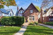 Stunning Brick English Tudor located mid block on a tree lined street. Private front porch on patio, enter to beautiful vestibule- to the left is a gorgeous step down living room with gleaming oak hardwood floors & original moldings, leaded windows, stone wood burning fireplace, enter to rear sun filled enormous great room extension with cathedral ceilings, sky lights & a/c & heat unit- 2 sep exterior entrances to yard, eat in kitchen with plenty of cabinetry and counter space also enters to rear extension giving an open floor feel, elegant & beautiful formal dining room with oak trim on walls perfect for entertaining guests, 2 primary size bedrooms (1 can easily be converted to 2) on second floor with large bathroom.  This is a classic, beautiful home and won&rsquo;t last!