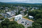 This recently renovated two-bedroom top floor apartment in the heart of Pawling Village won&rsquo;t last! Walk-to-everything convenience and just blocks to the Pawling Metro North Train Station. From the back of the parking lot, walk-up two flights to a private enclosed porch, fantastic for extra storage, coat and shoe racks with room for outdoor furniture. Enter the kitchen with granite counters, soft closing cabinetry, subway tile backsplash and stainless-steel appliances. The living and dining room has French doors for added privacy and a closet. From the center hallway are the two bedrooms, full bath, a small room (home office or den), front hall closet and front door that takes you down three flights to Elm Street. It&rsquo;s a great layout accented by refinished hardwood floors and abundant natural light, in addition to the charm and character you will find in each unit. With the large parking lot behind there&rsquo;s plenty of parking. The building features a coin-op laundry room in the basement. The tenant is responsible for electric (electric heat), cable and to provide tenant insurance. The Landlord is responsible for water, sewer, hot water, garbage, lawn, snow. Landlord requests good credit, no dogs and no smoking. Walking distance to the quaint Village of Pawling with fine dining, fun eateries, boutique shops, cultural attractions, and numerous outdoor activities. No car is needed with the Metro North train station just blocks away. Available for immediate occupancy. Additional Information: Storage: See Remarks, LeaseTerm: 12 Months, Renewal Option, ConstructionDescription: Wood Siding,  RentIncludes: Grounds Care, See Remarks, Snow Removal, Trash,