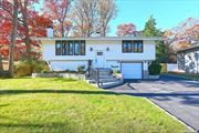 Welcome to your beautifully renovated dream home in the desirable Tulipwood section of Commack. This stunning property features brand new everything from the light and bright modern kitchen with stainless steel LG appliances and Quartz countertops to the three luxurious bathrooms and the generously sized primary ensuite with gleaming hardwood floors throughout. The living/dining room centerpiece is the wood burning fireplace for cozy winter nights and brand new central air for those hot summer days. Vaulted ceilings, recessed lighting, new doors, new walls, new siding, 1.5 car garage with brand new washer and dryer,  Dont miss out on this opportunity to own a completely updated gem. Call to schedule your showing today.