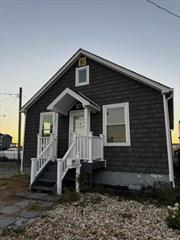 A boaters dream location! This updated cape is one house off the Great South Bay on a private canal with room for dockage. Home was updated in 2021 - new roof, siding, kitchen, flooring. This property has a spacious design with room to grow. Very private location, ample parking, and amazing views. This would be a great starter home or perfect for those looking to downsize. Shore Road park is steps away with fields and new play ground. Don&rsquo;t sit on this one!