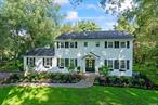 This stunningly renovated colonial is located in a picturesque neighborhood with oak tree-lined streets and beautifully maintained homes set back on flat 1-acre properties.  Upon entering the foyer you immediately feel its bright coastal design highlighted by the lightly stained oak floors and blue seagrass wallpaper. The foyer&rsquo;s beautiful custom millwork, which runs up the staircase and throughout the formal dining room, adds texture and a layer of elegance to the home. The kitchen was designed for modern living, complete with new Viking appliances and a 7-foot island. The warm, lightly veined stone countertops and polished Carrara backsplash give the room a timeless feel and that will endure the test of time. The kitchen opens to a great room that features an informal dining area, large seating area, and a wood burning fireplace surrounded by custom built-in book shelves. Adjacent to the kitchen is a beautiful, color drenched butler&rsquo;s pantry with its own sink. The butler&rsquo;s pantry has direct access to the dining room and can serve multiple purposes - a staging area for larger dinner parties, a perfect place to mix a drink in the evening, or a quiet spot to pour that first cup of coffee in the morning. It also provides direct access to the backyard via a large wooden deck. Upstairs the primary bedroom was thoughtfully designed for tranquility and serves as an oasis for rest and relaxation. A seated nook was created that can serve as a quiet place to work or finish getting ready. The primary bath, with double oak vanities and a large custom shower, is covered with Carrara marble creating a warm and luxurious space. Completing the primary bedroom are two, custom built walk-in closets each with double doors to allow for maximum space. Three additional well-sized bedrooms with 48 inch double closets and a full bath complete the 2nd floor. As you walk the property you are surrounded by various mature plantings such as large white oaks and weeping cherry trees. Many new professionally landscaped plantings, including over 75 hydrangeas and boxwoods, surround the perimeter of the home and pool giving it the feel of Hamptons retreat in the summer. There are multiple areas for outdoor entertaining around the 20&rsquo; x 40&rsquo; inground pool and on the large wooden deck off the back of the home which has its own charming gazebo. A long and wide driveway provides ample parking and access to the attached two-car garage that has direct entrance to the lower level of the home - a convenient feature on those rainy days. Other notable upgrades include Certainteed cedar-style vinyl siding, central AC, forced hot air heating system, and a new 20-zone irrigation system.  This classic home with its timeless style, thoughtful renovations, and lush landscaping is awaiting its new owners.