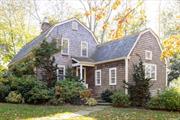 Located on picturesque Old Harbor Road in the coveted seaside hamlet of New Suffolk, this irresistibly charming Dutch gambrel home was built by a master craftsman and lovingly referred to by the former owner as The Guest House. The residence features two ensuite bedrooms, three full baths, a sun-drenched dining room with a wood-burning fireplace, a large living room with an additional wood-burning fireplace, a cozy den with built-in shelving, and a beautiful screened-in porch. A single-story chef&rsquo;s kitchen overlooks the yard, featuring a soaring vaulted ceiling and large French doors that open onto a generous bluestone patio. The property&rsquo;s highlight is its magical grounds, which include a large in-ground gunite-heated saltwater pool, a handsome barn, and a professionally designed landscape with winding garden paths dotted with century-old trees, mature hollies, and vibrant hydrangeas. The result is a stunning green enclave that creates a private and enchanting setting. A sandy bay beach, Old Cove Yacht Club, and Shagwog Marina are just down the street. The property is two minutes from New Suffolk&rsquo;s restaurants and business district and minutes to Cutchogue&rsquo;s downtown.