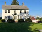 An 1840 Center Hall Colonial nestled on over 8 acres of fertile land, boasting a barn with a 188x36 ft footprint, including a second-floor hay mow. The original post and beam shelter, enhanced over generations, showcase laminated curved beams and original past and beam framing a truly remarkable structure. While the home stands sturdy, it beckons for a 2023 revitalization, offering a chance to restore its historical charm and meet modern standards. An investment poised to blend historical significance with contemporary living., AboveGrade:2996, Basement:Interior Access, EQUIPMENT:Carbon Monoxide Detector, Smoke Detectors, FLOORING:Vinyl, Wide Board, Wood, FOUNDATION:Stone, Level 1 Desc:EIK, PANTRY, HALF BATH, FAM RM, DR, LR, BR, OFFICE/DEN, , Level 2 Desc:4 BEDROOMS, FULL BATH, Level 3 Desc:WALK UP ATTIC WORTH NOTING = 4 SEAMLESS 39&rsquo; PURLINS, MISCELANES:Fixer Upper, Other School:PRIVATE, OTHERROOMS:Family Room, Pantry, Sun Room, ROOF:Asphalt Shingles