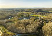 Located in the center of Stanfordville, in upstate Dutchess County NY, this Hudson Valley opportunistic open development area is now available. The entire 5.02 acres are usable and zoned Rural Center with mixed use (commercial and residential) possibilities. The site is entered on an existing DOT approved road to a deeded 25&rsquo; wide right of way to the property. The land is sub dividable and currently wooded with some partial clearing. A satisfactory soil/perc analysis for septic system is in place with documentation. The sand/gravel on the parcel provides excellent drainage. Nearby is a mix of residential homes, Pharmacy, Office/apartment building, Library, Farm Market, and Hardware store. This is nearby to the towns of Rhinebeck, Millbrook, Pine Plains, Millerton and more. All this is just two hours from New York City and is also accessed via Metro North in Poughkeepsie or Wassaic and Amtrak in Rhinebeck., DOCUMENTS:Drawings, Subdivision Approval, IMPROVMNTS:Drive, Wooded Acres:4.00