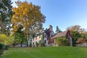 This magnificent 5-to-6-bedroom stately stucco home is unique in Dobbs Ferry for its prime and peaceful corner property, affording sweeping and uninterrupted views of scenic golf course greenery. Recalling the charm of the Cotswolds, it is set on a level .33 acres. Elevated from the street by bucolic stone walls and evergreen shrubbery, the home offers profound tranquility that is unusual in a home only minutes away from the heart of downtown. The extensive interior, with hardwood floors and period moldings, takes every advantage of the astonishing location. A living room, with attractive wood-burning fireplace, offers a commanding panorama of the golf course from two exposures, with a picture window extending the expansive sky and fairway views as far as the eye can see. An adjacent dining room has its own picture window vista and door to the back yard. The homeâ€™s enormous great room is a showstopper, with 14&rsquo; high vaulted ceiling, windows onto greenway vistas, wood parquet floor, brick-arched wood-burning fireplace, and a 20-ft-long wall of wood built-ins. Southern light streams into a spacious modern country kitchen/butler&rsquo;s pantry with direct access to a side yard porch. Up the entry foyerâ€™s light-filled stairway, find a primary bedroom featuring 2 sunny exposures, both overlooking the greens, and a dressing vestibule leading to an ensuite bath with its own view. Two additional cheerful corner bedrooms share a hall bath, while the 4th bedroom has access to the primary bath, perfect for nursery or home office. As a bonus, discover a sizeable third floor offering the homeâ€™s 5th and 6th bedrooms, as well as a generous hall bath with wood wainscotting and more golf course views. A lower level contains areas for laundry, workshop, and home storage, with door to side yard. A charming alley behind the wood fencing at the yardâ€™s southern border is used to access the homeâ€™s detached garage at the rear corner of the property. Though it may feel hard to imagine, the Middle/High School is just up the street, and the Aqueduct Trail, Juhring Nature Preserve, Gould Park/Pool, downtown shopping, and the MetroNorth train are all just blocks away! For its space, location, and the serenity that we all seek, this home should be tops on your list!