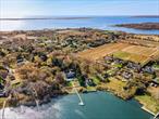 Welcome to a unique opportunity on Dock Dow Road in East Moriches, a 1.20 acre waterfront property south of the highway! This property offers a blank canvas for you to create your dream home. A stone throw from the Hamptons and an easy commute to NYC. This expansive lot is nestled in a tranquil and friendly community, where every day brings the promise of new beginnings. The property is conveniently located, providing easy access to local amenities such as shopping, dining, and recreational waterfront spots. Whether you prefer leisurely strolls in the park, dining at local eateries, or browsing through charming boutiques, this location caters to a variety of lifestyles. The property itself is a testament to the potential of imagination. It is ready and waiting for you to bring your vision to life. Whether you dream of a modern minimalist home, a cozy cottage, or a grand estate, this lot offers the flexibility to accommodate your architectural aspirations; design plans to build a 4, 000 SQFT home available to a very interested buyer!