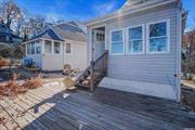 Beautiful water views and beach access await you here. 2br and 1ba cottage with shared driveway and adorable covered porch. Enjoy morning coffee on the deck overlooking the Port Jefferson Harbor while hearing the waves crash. Serenity tucked away in lovely Three Village School district.