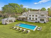 Located on 1.24 acres south of the highway in the desirable village of Quogue, this stylish new construction offers a sophisticated blend of classic architectural style and modern amenities. The 6245 SF+/- of meticulously crafted interior space boasts 6 spacious bedrooms and 5.55 bathrooms, and a thoughtful layout designed for both entertaining and ease of living. The double-height foyer leads to an airy great room with fireplace that flows easily to indoor and outdoor living spaces. The professional kitchen - with its top-of-the-line appliances, custom cabinetry, and expansive island - connects to a formal dining room, a wet bar, and a screened dining porch. The communal spaces are as artfully designed as the private areas. The luxe first-floor primary suite includes a spa bath, generous closets, laundry, and outdoor access. Upstairs are four more elegant bedroom suites, additional laundry, and a bonus room ideal for use as a studio, media room, or play space. Step outside and enjoy the substantial deck overlooking a 25 x 40 gunite pool with built-in spa, and an open pool house with outdoor shower and half bath. The property is complemented by state-of-the-art smart features throughout, natural gas heat, a 3-car garage, and a lower level with a potential 3000+/-SF of additional living space. Situated at the end of a cul-de-sac, minutes from Quogue beaches and Gabreski airport, this is a modern showplace offering the ideal Hamptons living experience., Additional information: Interior Features:Lr/Dr