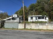 2 Houses for the price of one. These are two handyman specials for 199, 000!! The houses are on two separate deeds but are being sold at one price. This is an estate sale. The houses are located on Route 28 corridor minutes from Belleayre Ski Mountain and close proximity to Phoenicia, Hunter, and Windham Ski Mountains. Fly fishing across the street in the Esopus Creek or hike many of the local trails and mountains.