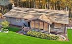 Donâ€™t let this unique opportunity slip away! This custom-built contemporary ranch, nestled on a quiet dead-end street, is sure to captivate you in every way. Set on a generous 0.9-acre lot, this home perfectly fulfills all your desires for a nature retreat.Step inside to discover an inviting entryway that leads to a bright and airy living and dining room, featuring a vaulted ceiling and a central stove as a striking focal point. Generous bay windows flood the space with natural light while offering stunning views of the outdoors. California-style windows throughout enhance the ambiance, while the updated eat-in kitchen boasts display cabinets, granite countertops, and stainless-steel appliances.Adjacent to the kitchen is a lovely study room with custom built-in bookcases and an oversized window, creating the perfect space for productivity. Conveniently located on the main level, you will find three bedrooms with walk-in closets and two full bathrooms.Descend to a spacious walk-out playroom, an additional bathroom, and two extra rooms for your personal use. This home is equipped with a gas line on the deck for grilling, a convenient laundry chute, and a full walk-out basement leading to a beautifully maintained yard, complete with a shed for storage.Situated in the most sought-after neighborhood, this property features double-glazed windows throughout, screen doors and windows, an intercom system, a new attic fan, and central air upstairs along with window units downstairs. The front and back doors are equipped with cameras for added security.This home truly has everything you desire and more! Don&rsquo;t waitâ€”schedule your showing today!