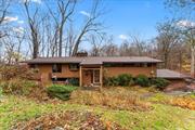 This stunning 3-bedroom, 3-bathroom bi-level home offers over 3, 000 sq. ft. of thoughtfully designed living space with seasonal views of Lake Katonah. With a mid-century modern aesthetic, the open floor plan features tall ceilings and abundant natural light that create a warm, inviting atmosphere. Outside, the home is surrounded by manicured gardens with specimen trees, a tranquil water feature with a waterfall, lights, and goldfish pond, plus a spacious sunroom and deck with built-in seatingâ€”perfect for enjoying the serene natural setting.The lower level includes a cozy family room with a fireplace, a sauna, ample storage, and two versatile bonus rooms ideal for a home office, gym, or potential in-law suite. A whole-house generator ensures peace of mind year-round. Timeless design meets modern convenience in this lakeside retreatâ€”welcome to your dream home!