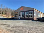 This 2-story commercial warehouse/woodshed is of steel frame construction, steel support beams and metal and stone siding. Metal roof, aluminum gutters build on a concrete slab. Building is heated partially by radiant floor heat on the 1st level.  Open woodshed-24&rsquo;X32&rsquo; and root cellar-16&rsquo;X16&rsquo;on the property. Interior- 1st floor consists of 1 office 1 half bath 2 workshops, utility area, 2 garage bays with overhead doors, half bathroom. 2nd floor has 2 offices 1 half bath storage area and small kitchen. Overall condition of the property in good condition and considered to be of quality construction. The SBL for the other 3 lots are as follows: 37.-1-6.7 Large Vacant residential lot adjoining all Holland Rd. properties and Maker&rsquo;s Off Main warehouse parcel, 10.6 acres. 36.-1-131.1 Large commercial vacant lot above the Maker&rsquo;s off Main Warehouse lot (1 of 2) 7.85 acres. 36.-1-131.3 Commercial Vacant Lot above Maker&rsquo;s Off Main warehouse lot, 3.75 acres. This is also combined with 3 other lots totaling 24.04 acres, entire lot total is 29.04 acres. If you are a business looking to expand or relocate, this is worth a look. Close to I-86 (Route 17) less than 2 miles from the Ferndale Exit.