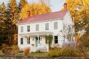 This charming center hall farmhouse, with its distinctive red metal roof and exceptionally well-preserved architectural details, was originally the quiet, historic hamlet of Linlithgo&rsquo;s local Post Office. Linlithgo was established in the late 18th century just down the road from the iconic Livingston estate and grounds, Teviotdale. In the 1800s, the village largely became home to workers employed by the Iron Mountain mine and the nearby Hudson River railroad depot. By the time the Post Office was built, the town had slowly become a blend of remaining mining families and gentlemen farmers. Today, the expansive and light-filled home has been appropriately modernized without losing its abundance of character. The original doors, hardware, and wide-plank hardwood floors have been carefully restored. There are four bedrooms on the second floor and an additional room downstairs with an en-suite full bathroom and its own entrance, currently used as a media room. There are two full bathrooms upstairs, one en-suite to the primary bedroom, and a powder on the ground floor. The second-floor laundry room has wood paneling, built-in drying racks, and shelving. The abundant storage space throughout is particularly rare in a home of this vintage, and the large mudroom and basement ensure the house has everything needed for an authentic country property. The surrounding land spans an acre, with a large vegetable garden, mature plantings, tall evergreens lining the property, and a restored original stone wall. A carriage house with concrete floors and shelving currently stores gardening supplies and would make an excellent future studio or workshop. The Post Office, the home&rsquo;s adopted moniker even many decades after being converted into a personal residence, is in good company nestled near Linlithgo&rsquo;s beautifully preserved schoolhouse and church. The property is minutes away from both Germantown and Hudson, which means a few of our favorite local spots - Otto&rsquo;s Market, Montgomery Place Orchards and Morningstar Farms, Clermont State Historic Site, Olana, the Hudson farmers market, and truly endless more places to wine, dine, and explore are just around the corner.