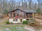 Cozy Cabin on 4.9 Acres! Discover your perfect retreat with this charming cabin tucked away on 4.9 picturesque acres in the Washingtonville School District. Whether youâ€™re seeking a peaceful getaway or a full-time residence, this property offers unmatched privacy and tranquility, all while being conveniently close to town and just an hour from NYC. The main level boasts an incredible sunroom with walls of windows, offering breathtaking views of the surrounding property. Step inside to an amazing living room with cathedral ceilings, a wood-burning fireplace, and floor-to-ceiling windows that bring the outdoors in.The level continues with an open eat-in kitchen, two bedrooms, and a full bathroom. The walk-out lower level has been thoughtfully renovated and features a possible third bedroom, full bathroom, and a spacious living area, perfect for a home office, game room, home gym, or guest suite. Additional highlights include a two-car carport and a brand new well pump and water filtration system. For those who love water, enjoy easy creek access right across the street. This one-of-a-kind property combines the best of both worldsâ€”peaceful seclusion and proximity to local amenities. Close to nearby hiking trails, farms, Storm King Art Center, Lego Land, and Woodbury Commons Outlets! Don&rsquo;t miss your chance to own this idyllic Hudson Valley gem!