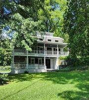 Turn back the hands of time with this beautiful home built in 1798 reminiscent of the deep south! It&rsquo;s 3 stories, two of which have gorgeous wrap around newly redone porches, that you can envision with rocking chairs, sipping mint juleps or enjoying a summer meal. The 3-story farmhouse has a newly refurbished kitchen, two living rooms, 3 bedrooms, two and a half bathrooms, a cozy fireplace and hardwood floors that add to its eloquence. All of this is situated on an acre of land with .46 of an acre across the road that has a babbling brook running through it. On the back of the property sits a 2-story renovated barn, perfect for an art studio or whatever your mind imagines with plenty of storage below. More than 90% of the property is newly fenced in perfect for dogs to run! There is also a back shed for mowers and such, a corn crib which is a rare find in Dutchess County these days, and a large tool shed off the patio next to the main house for storage or a he/she shed. A large portion of the lawn is flat, with outside electricity, perfect for tent parties, a gazebo or pool! This house and land are rich in local history and was a part of a large working farm back in the day known to the locals as Woodinville. Bring your imagination and dreams and come see this beautiful, rare & unique home! OWNER MOTIVATED! Additional Information: Amenities: Guest Quarters, Heating Fuel: Oil Above Ground,